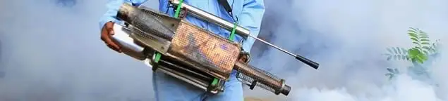 Fumigation technician using a fogger for deep pest treatment in Chandler, AZ